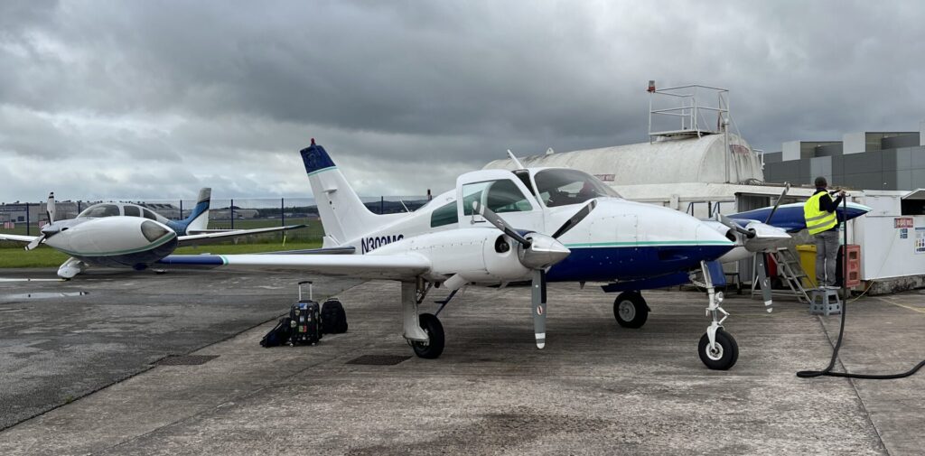 Cessna 310 N302MC being refuelled at Hawarden aiport