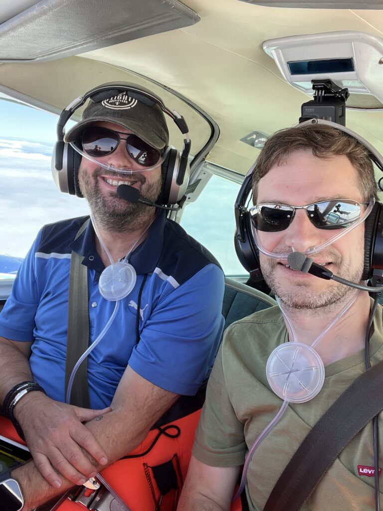 Dave and Daniel in the cockpit with oxygen cannulas